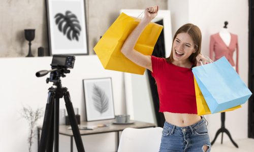 happy-blogger-holding-shopping-bags